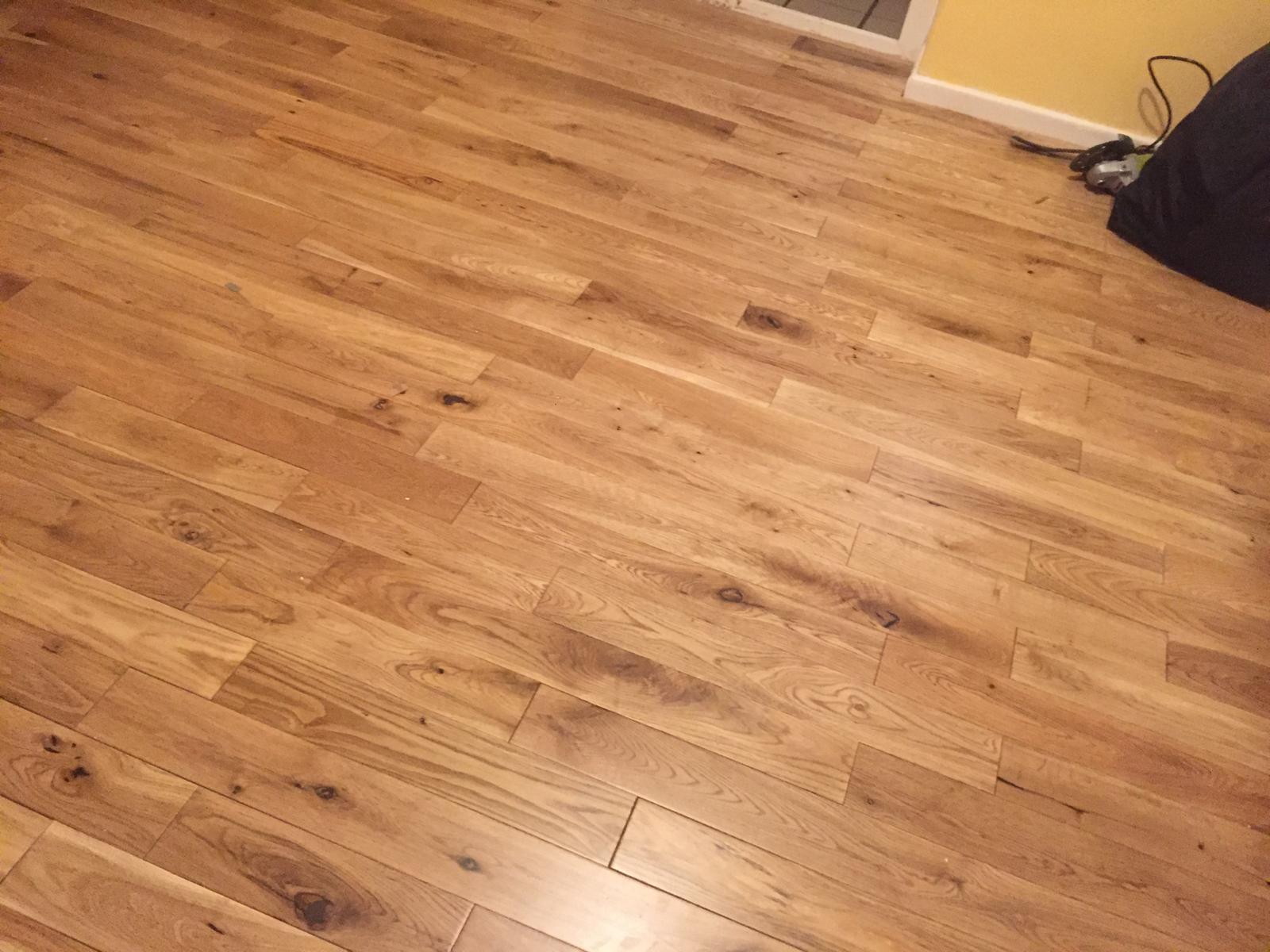 Solid oak flooring finished across a full living room